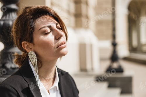 Preview: Portrait of a young beautiful woman with a large stylish earring