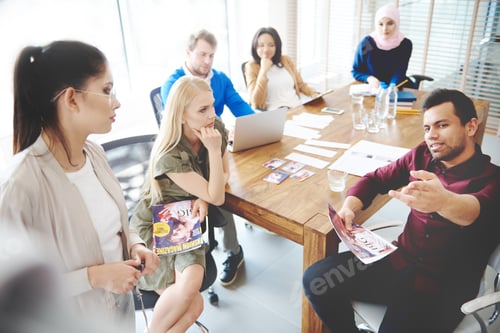 Preview: Top view of people having business meeting
