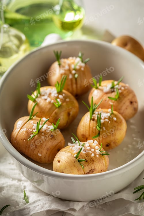 Preview: Ingredients for homemade baked potatoes made of salt and rosemary