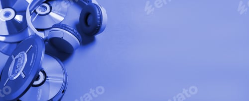 Preview: Personal compact portable CD player disks headphones blue neon background, Top view