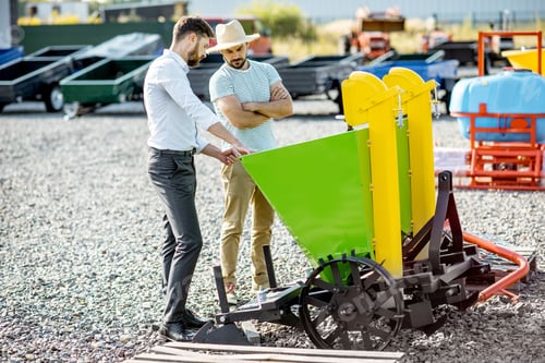 Preview: Agronomist with salesman at the agricultural shop