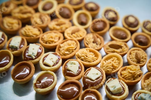 Preview: Baked sweet nut halves filled with cream and chocolate fudge