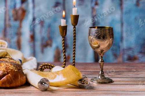 Preview: Shabbat eve table challah bread and candelas with kidush kosher wine