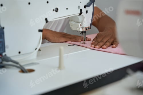 Preview: African American male dressmaker working in atelier