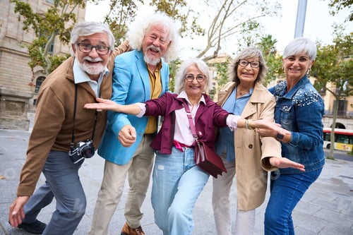 Preview: Group of senior friends posing playful in city