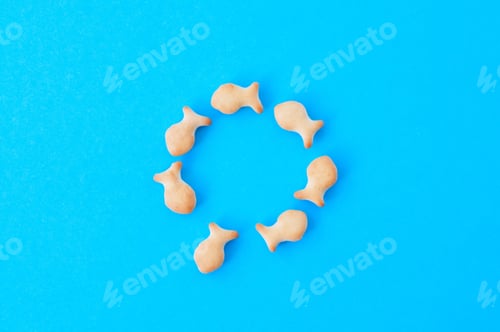 Preview: Fish crackers on blue background