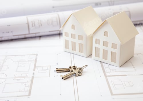 Preview: Construction concept. Residential building drawings and house keys on an office desk