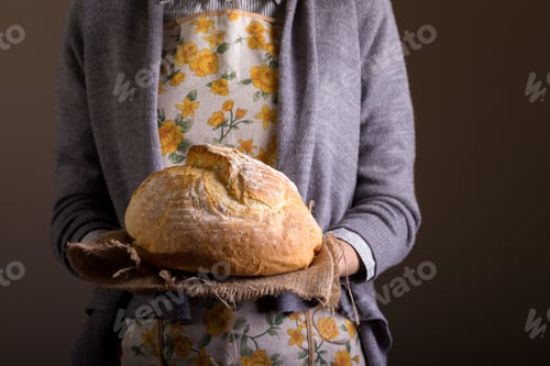Preview: girl holding fresh white bread