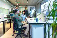 Preview: Business people collaborating on project in modern office space