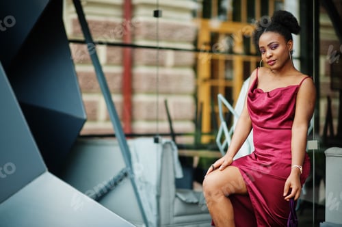 Preview: Black model in red silk dress.