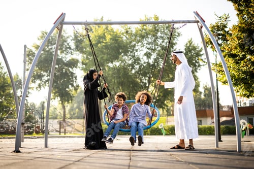 Preview: Cinematic image of a family playing at the playground