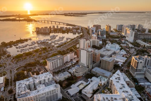 Preview: Sarasota, Florida at sunset. Luxury yachts docked in Sarasota Bay marina.