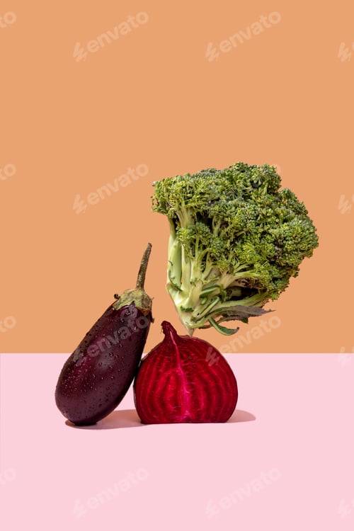 Preview: Broccoli, beet and eggplant on a light background. Modern still life. Levitation.