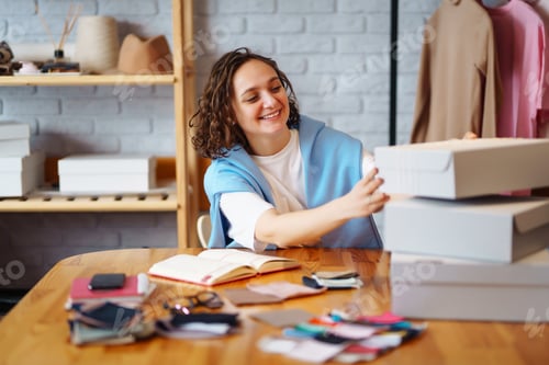 Preview: Small business owner, entrepreneur, seller using tablet checking ecommerce clothing store orders.