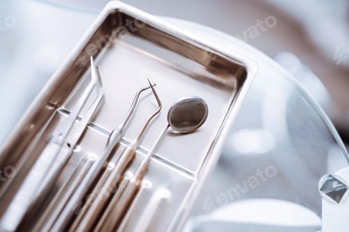 Preview: A set of sterile dental instruments for dental treatment. Dental care for people.