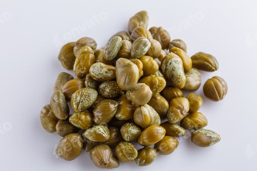 Preview: Pickled capers on a white acrylic background