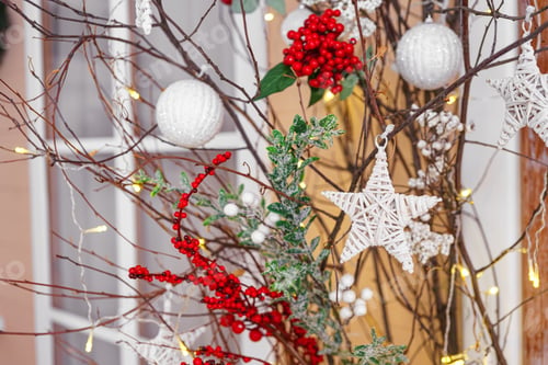 Preview: Christmas decor red berries with green leaves on shining lights background and pine cones