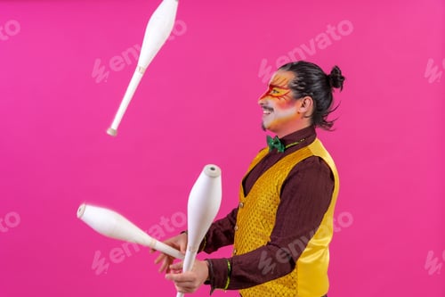 Man with Face Paint Juggling White Pins