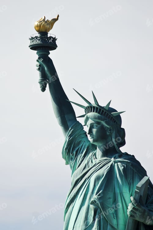 Preview: Famous statue of Liberty against the blue sky in New York