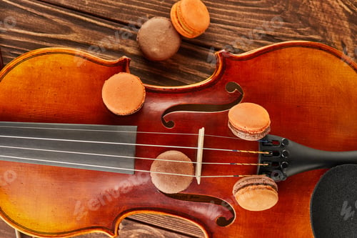 Preview: Colorful Macarons Arranged on Violin, Wooden Background