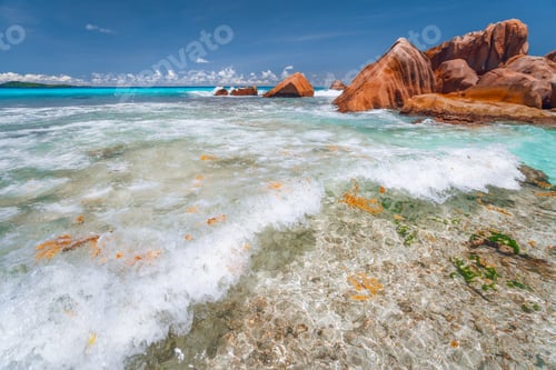 Preview: Anse Cocos la Digue, Seychelles. Secluded Tropical paradise Beach. White wave rolling towards the