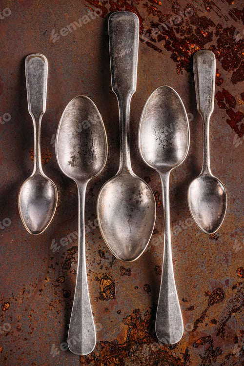 Preview: Set of old spoons on vintage rusted table