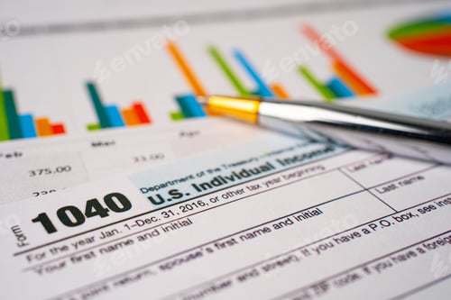 Preview: Bangkok, Thailand - June 1, 2020 Tax Return form 1040 and dollar banknote, U.S. Individual Income.