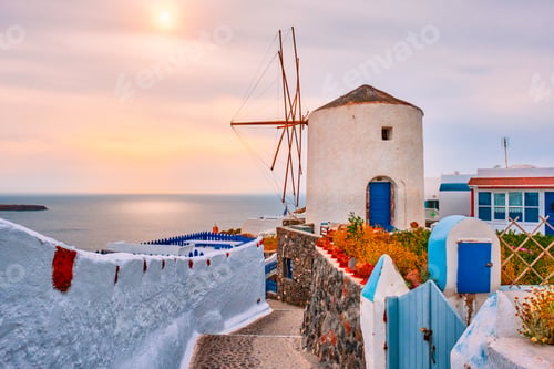 Preview: Old greek windmill on Santorini island in Oia town with stairs in street. Santorini, Greece