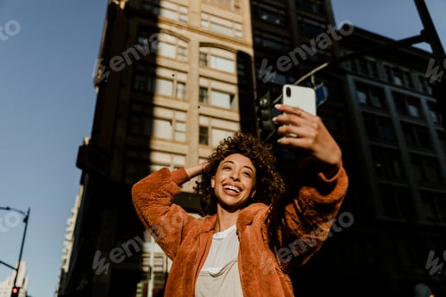 Preview: Black female blogger recording her live in downtown