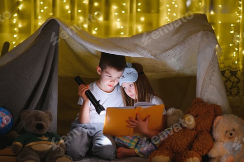 Preview: Boy and Girl Reading a Book in Tent