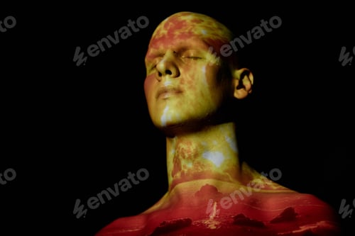Preview: Man with Eyes Closed Posing with Image of Atomic Bomb Explosion Projecting on Face