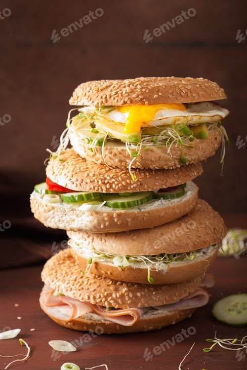 Preview: variety of sandwiches on bagels: egg, avocado, ham, tomato, soft