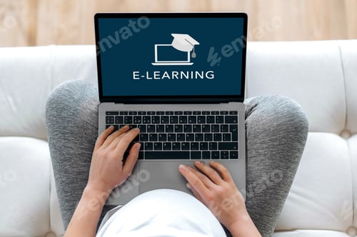 Preview: Online training during pregnancy. E-learning concept. A pregnant woman holds a laptop while sitting