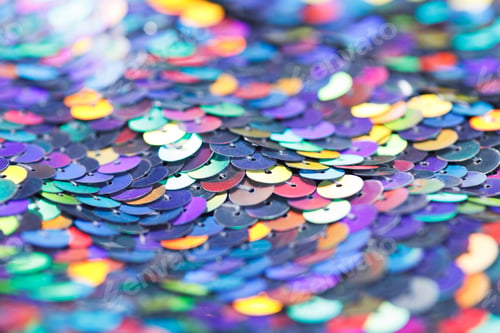 Preview: Closeup shot of a shiny multicolored sequin fabric.