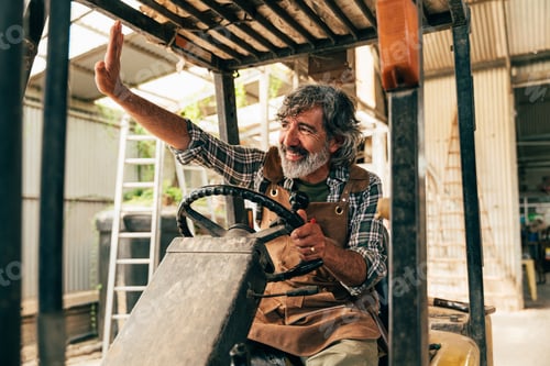 Preview: Farmer senior man working in his farm and greenhouse