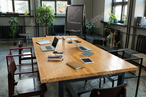 Preview: Large table with business objects and group of chairs around it