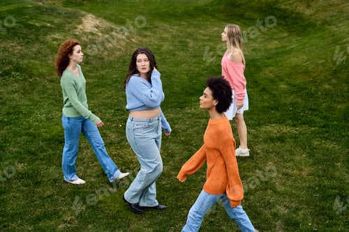 Preview: Chic spring stroll in the park showcasing stylish confidence and femininity among friends