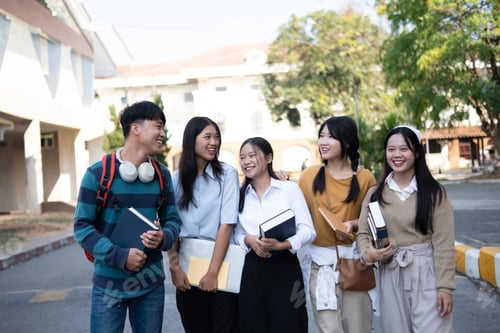 Preview: Campus students walking. College friends laughung while walking on campus.