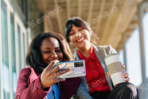 Preview: Two multiracial office worker women