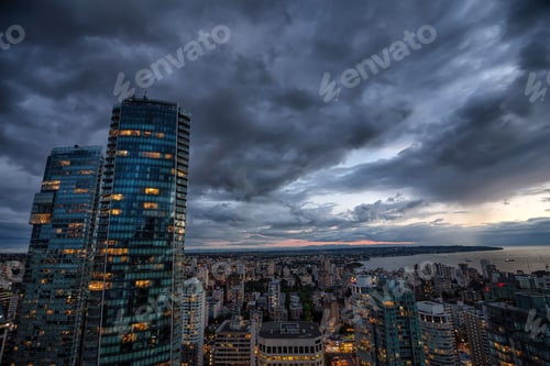 Preview: Aerial view of Downtown City during a stormy summer sunset