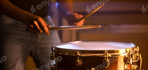 Preview: man playing the snare drum on a beautiful colored background