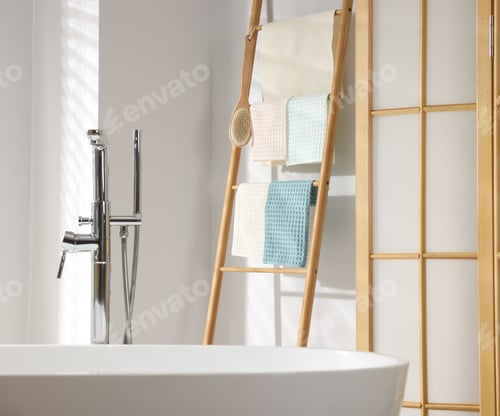 Preview: Fresh clean waffle towels drying on rack in bathroom