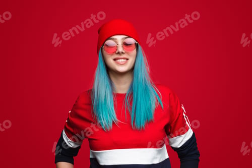 Preview: Trendy hip-hop stylish woman on red background