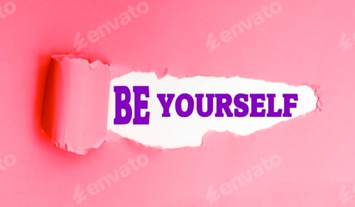 Preview: Be Yourself slogan on torn orange paper, motivational and self-esteem message.
