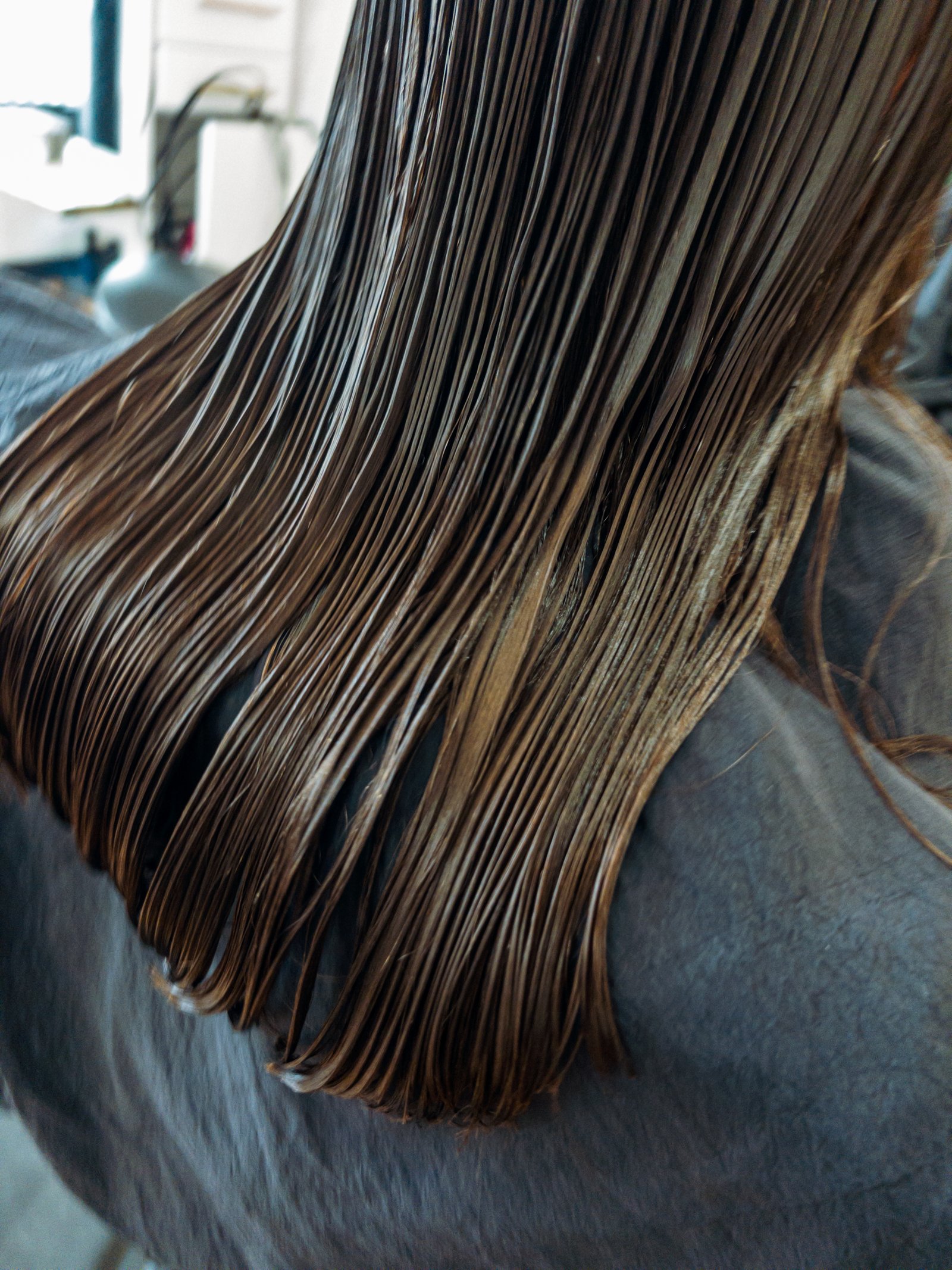 Treatment products work at the strand level, they change how the hair behaves, not just how it looks