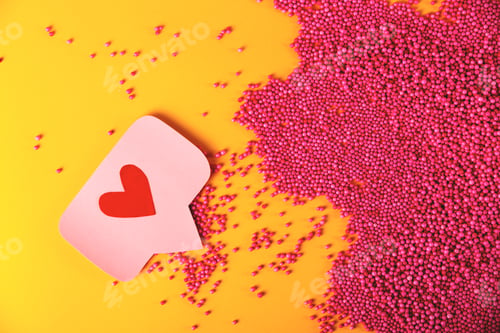 Preview: Red like heart icon on a pink pin next to pink balls texture.