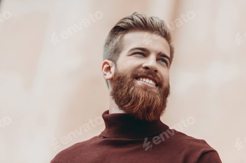 Preview: bottom view of handsome bearded man looking away