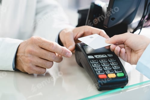 Preview: E-commerce e-banking cashless wireless payment with credit card at drugstore pharmacy at cash point