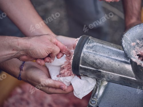 Preview: Crop person near mincing machine