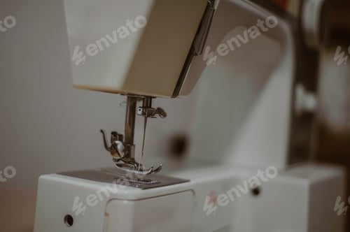Preview: Closeup shot of a sewing machine on the blurred background - industry
